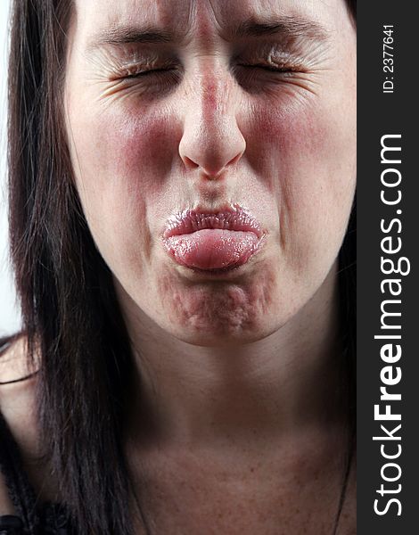 Close-up of a woman pulling a funny face. Close-up of a woman pulling a funny face