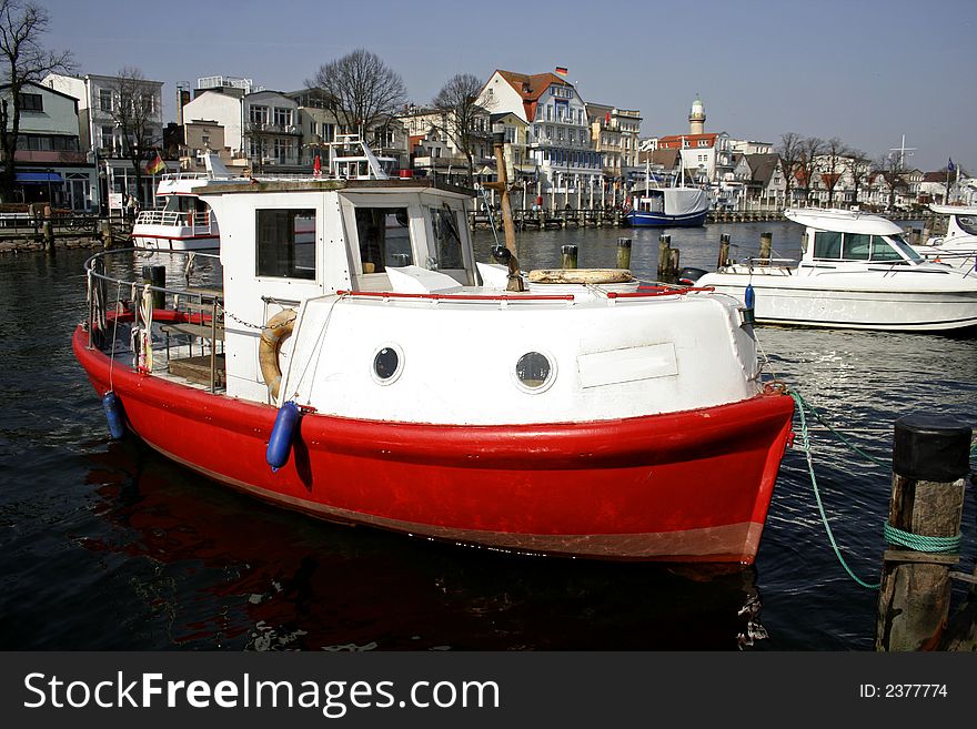 Red fishing boat in marina
