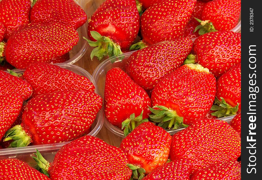 Close-up of baskets of strawberries for sale in a street market