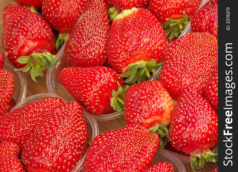 Close-up of baskets of strawberries for sale in a street market