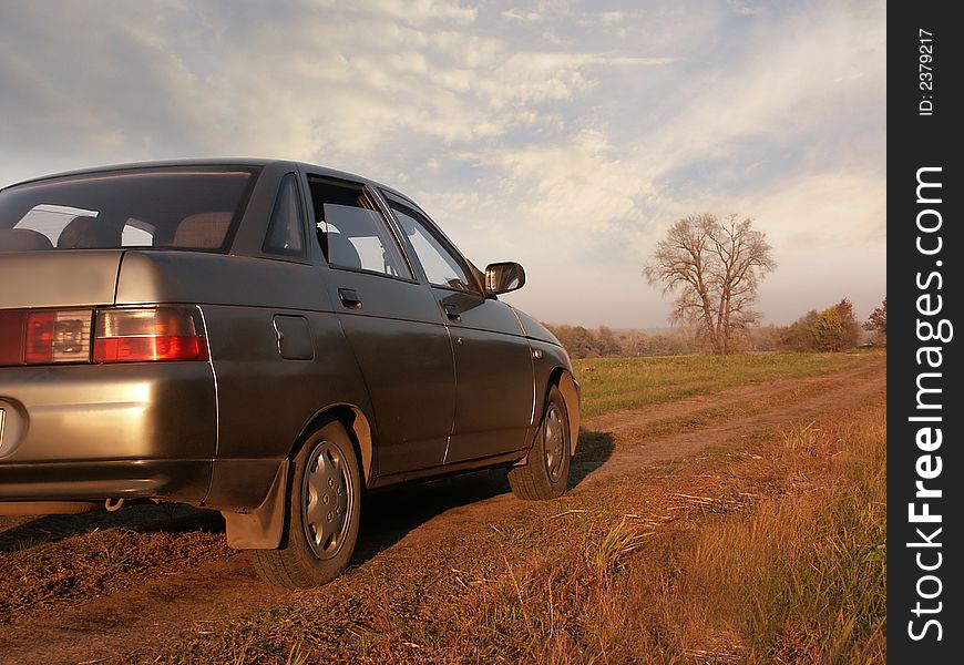 Shiny russian sedan car at the rural scenic