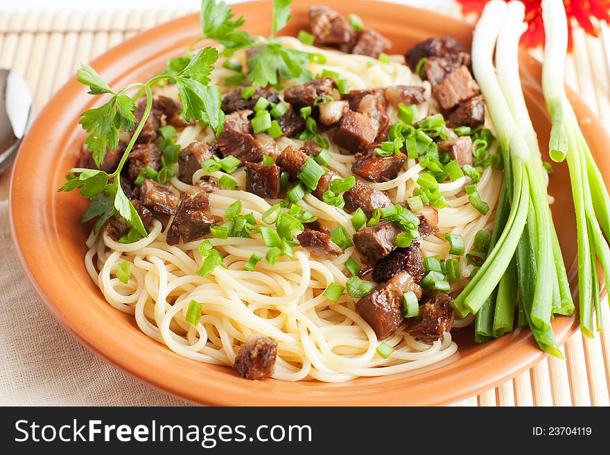 Delicious spaghetti with fried meat