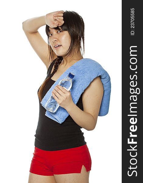 Asian girl with towel and bottle of water isolated on white. Closeup, vertical composition