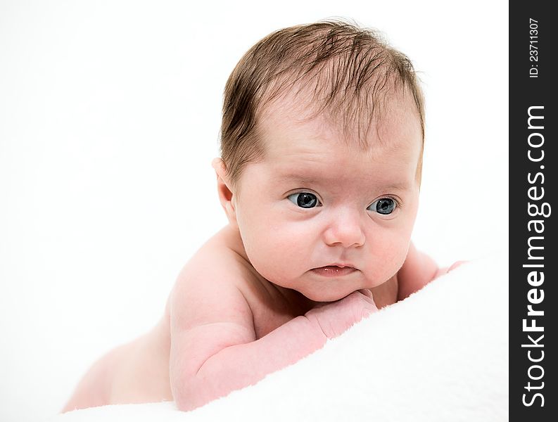 Portrait Newborn Baby Lying In Bed