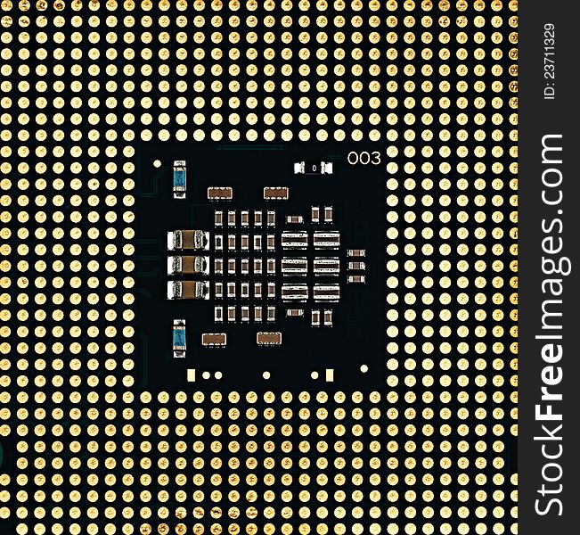 Computer the processor on a white background is isolated gold color with a microcircuit. Computer the processor on a white background is isolated gold color with a microcircuit