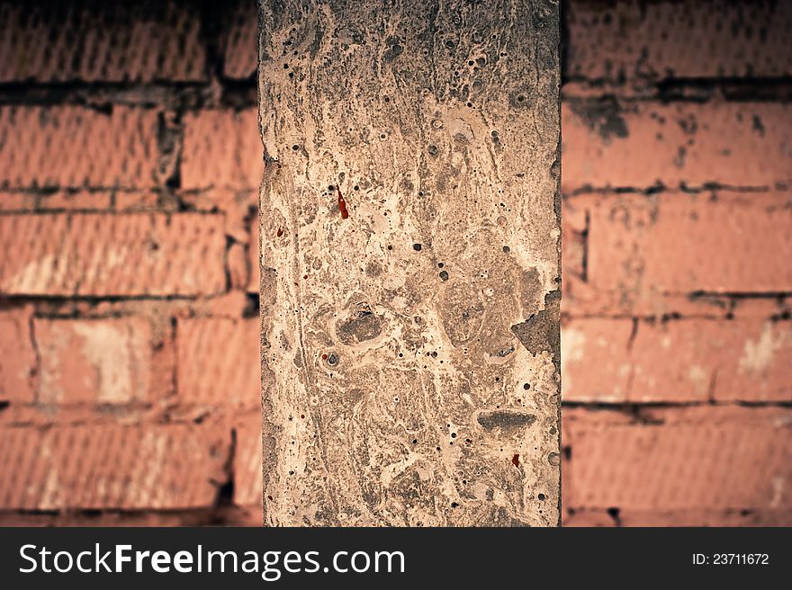 Old cement column at brick wall. Old cement column at brick wall