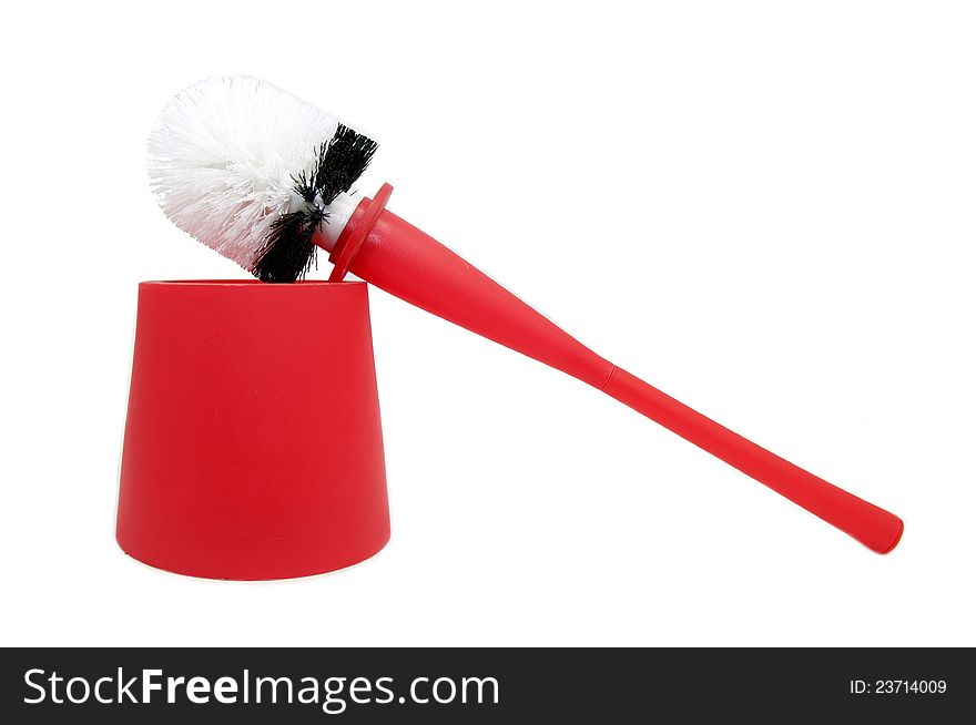 Red brush for cleaning the toilet bowl on a white background