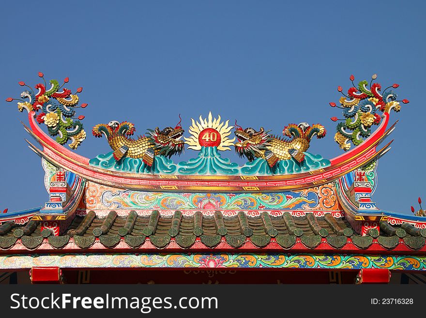 Golden dragons on roof of Chinese shrine. Golden dragons on roof of Chinese shrine