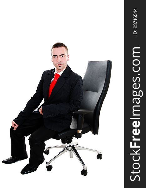 Young businessman sitting in office leather armchair - isolated on white. Young businessman sitting in office leather armchair - isolated on white