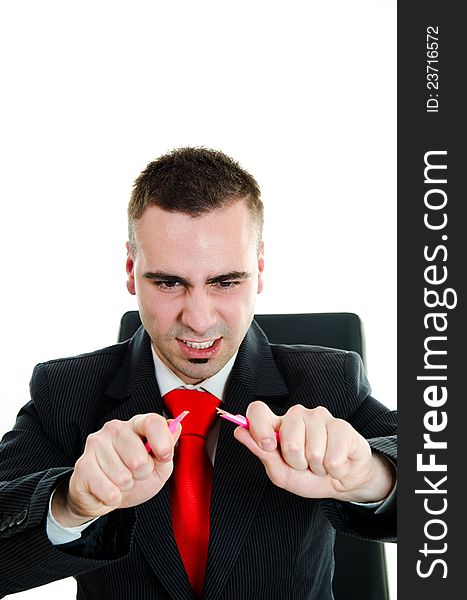 Furious angry businessman breaking a pencil. Furious angry businessman breaking a pencil