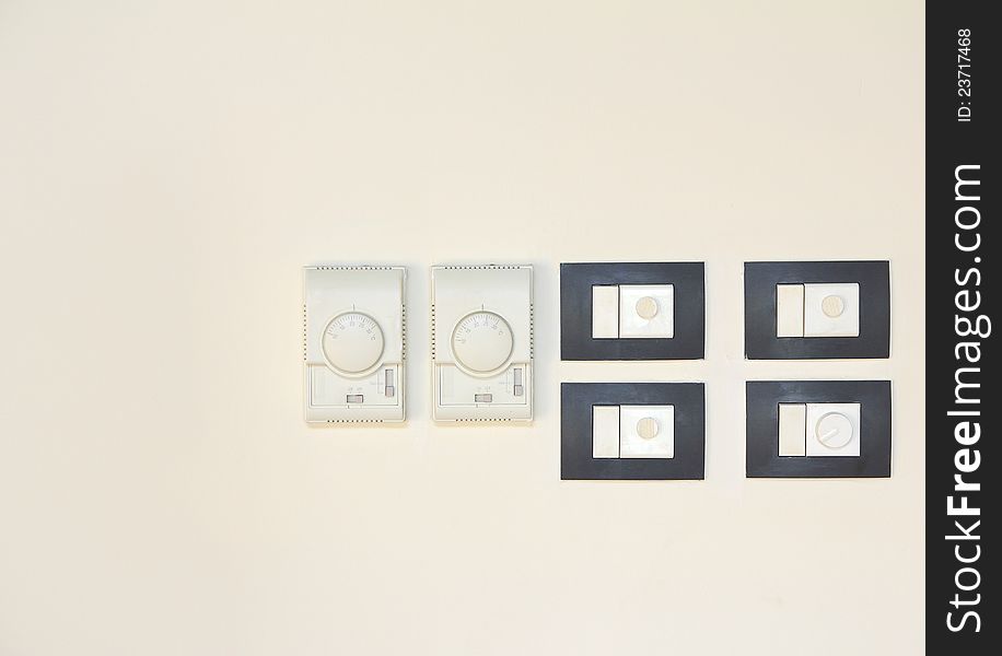 Electric switch on wall background