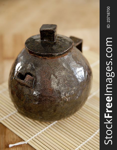 Small, brown, handmade ceramic teapot. Small, brown, handmade ceramic teapot