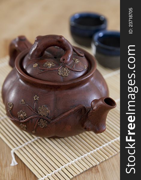 Rustic, brown Asian ceramic teapott. Rustic, brown Asian ceramic teapott