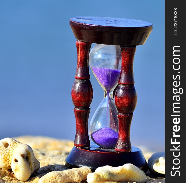Wood hourglass  on blue background