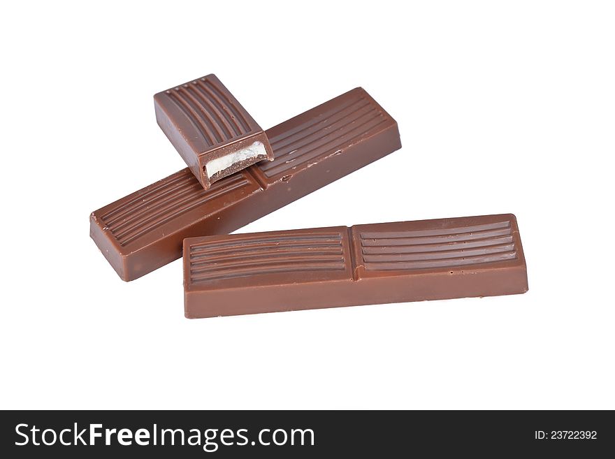 Whole and half small milk chocolate bars isolated on white background