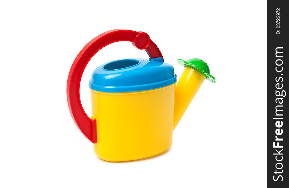 Colored children watering can against the white background. Colored children watering can against the white background.