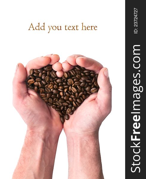 Strong man's hands gently hold grains of coffee in the form of heart. Strong man's hands gently hold grains of coffee in the form of heart