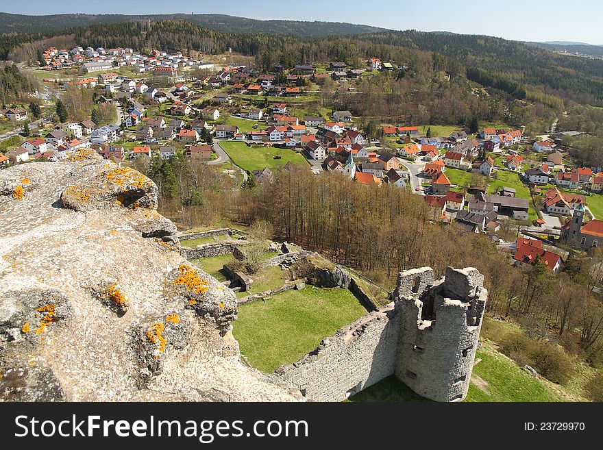 View on a town and a castle ruin