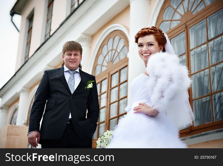 Happy Bride And Groom Near Ancient Palace