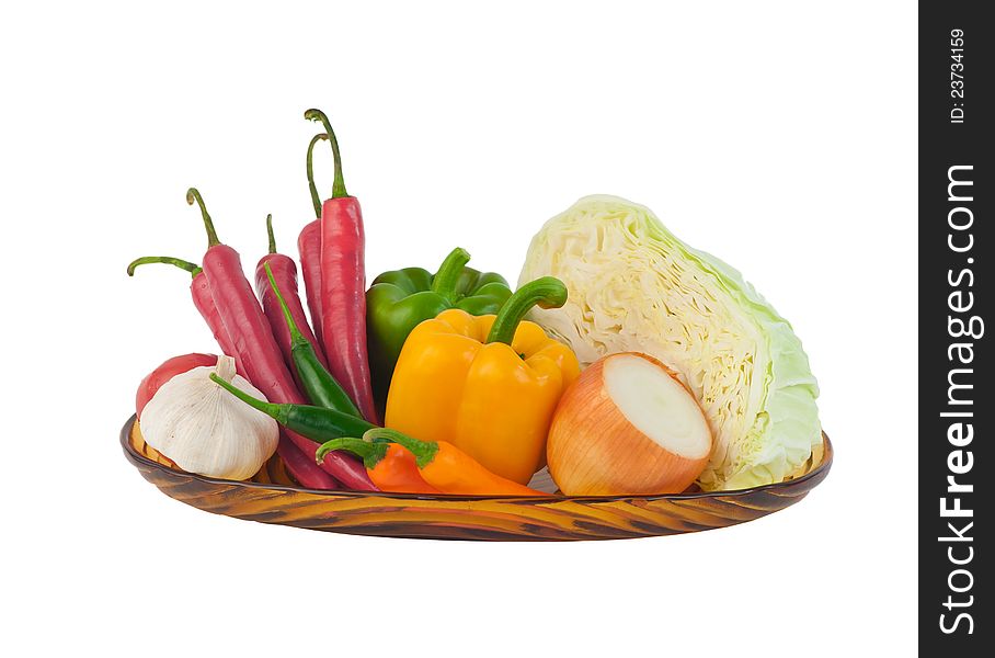 Variety clean vegetables on dish such as asian chilis garlic sweet pepper onion and cabbage display on white background ready for cooking. Variety clean vegetables on dish such as asian chilis garlic sweet pepper onion and cabbage display on white background ready for cooking