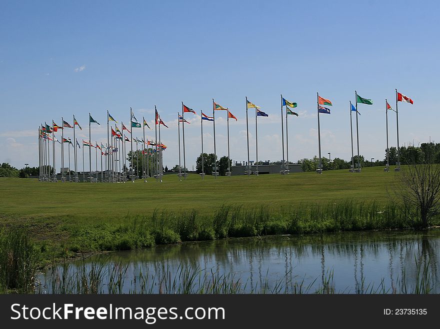 Flags of the world waving over blue sky,Royal Canadian mint,winnipeg,Canada