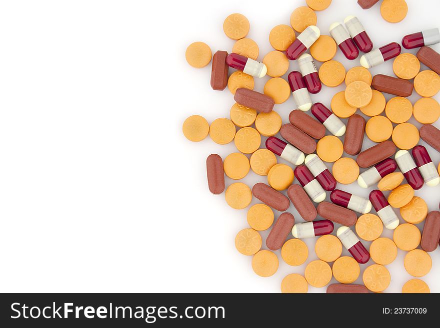 Colorful tablets with capsules isolated on white. Colorful tablets with capsules isolated on white