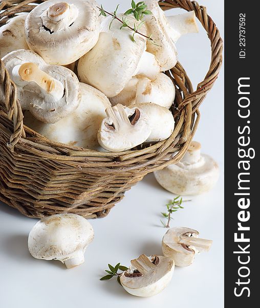 Champignons in basket  and herbs