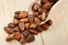 Wooden Scoop With Pine Nuts Stock Photo