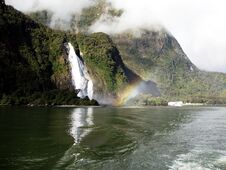 Rainbow Waterfall - Milford Sound, NZ Stock Image