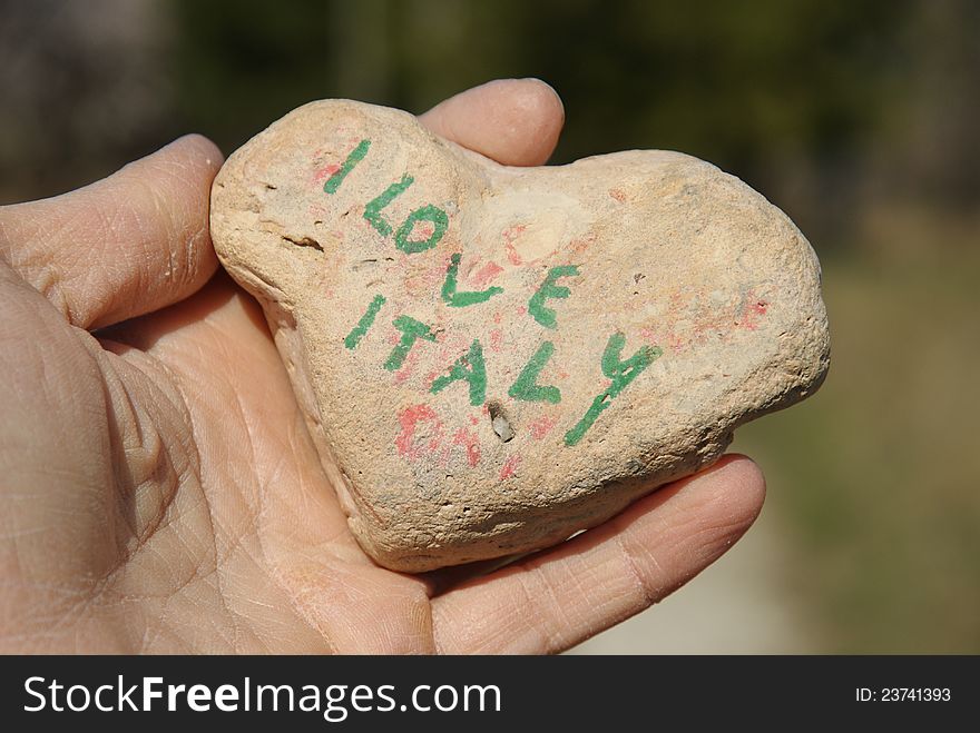 Italy my love, written on a stone heart. Italy my love, written on a stone heart