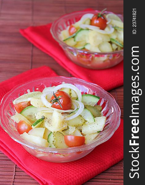 Salad with potatoes, cherry tomatoes, onion, cucumber, pickles. Salad with potatoes, cherry tomatoes, onion, cucumber, pickles