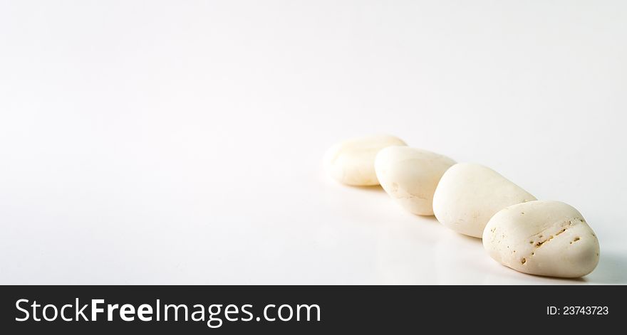 White stones on a white background. White stones on a white background