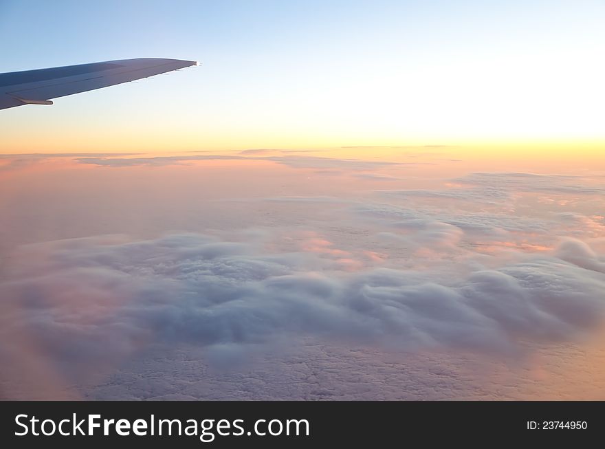 Wing of an airplane and low clouds