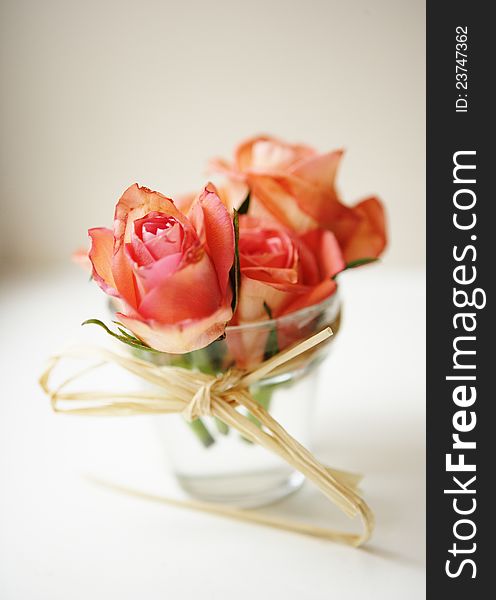 A wedding composition of roses in a glass