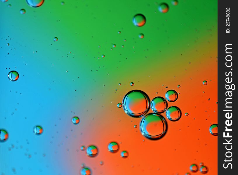 Color photo of bubbles at varying degrees of distance from viewer on multicolor background. Color photo of bubbles at varying degrees of distance from viewer on multicolor background