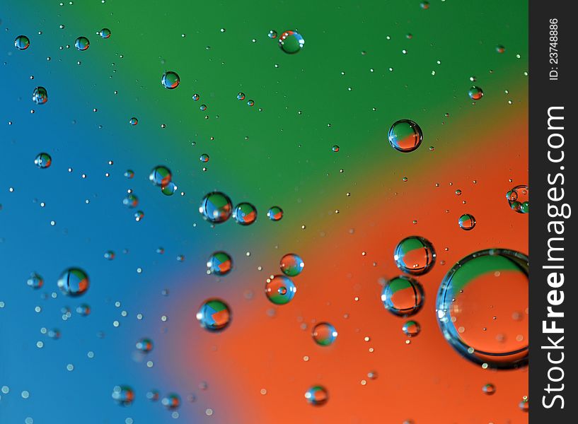 Color photo of bubbles at varying degrees of distance from viewer on multicolor background. Color photo of bubbles at varying degrees of distance from viewer on multicolor background