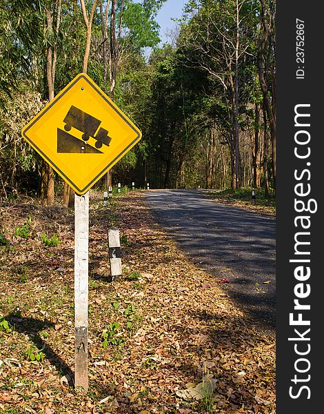 Yellow traffic sign in the tropical forest. Yellow traffic sign in the tropical forest