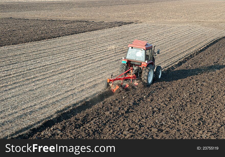 Tractor Plowing in sunset