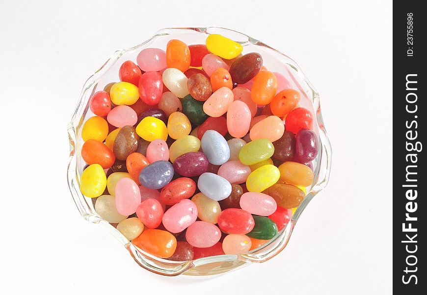 Jelly bean sweets (candies) in glass dessert bowl isolated on white. Jelly bean sweets (candies) in glass dessert bowl isolated on white.