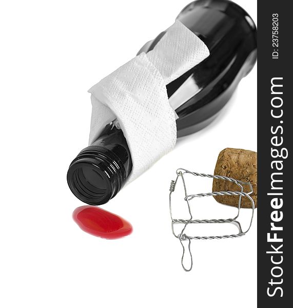 Red wine is outpoured from a bottle on a white background. Red wine is outpoured from a bottle on a white background