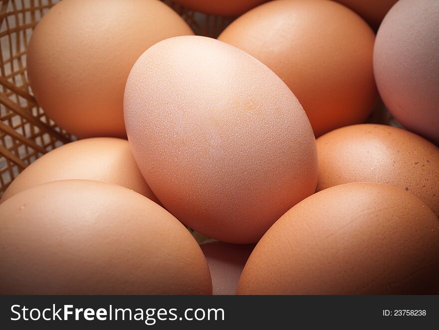 Composition of chicken eggs and wicker baskets