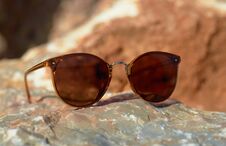 Sunglasses On The Beach Summer Sun Stone Close-up Stock Images