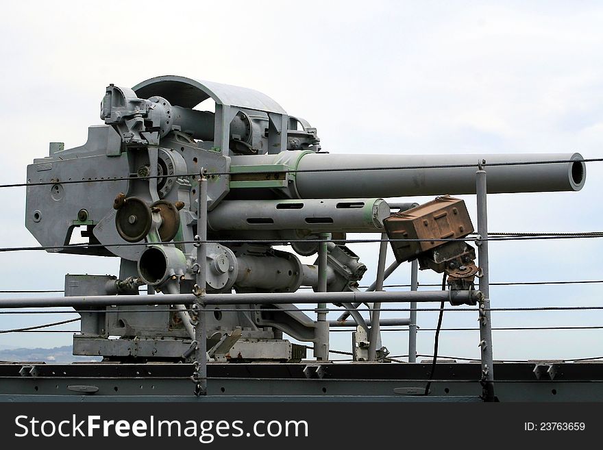 A large cannon mounted on a warship