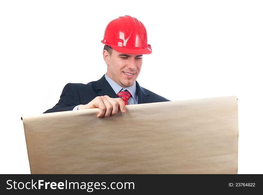 Handsome smiling engineer with red helmet on his head looking at blueprint isolated on white. Handsome smiling engineer with red helmet on his head looking at blueprint isolated on white.