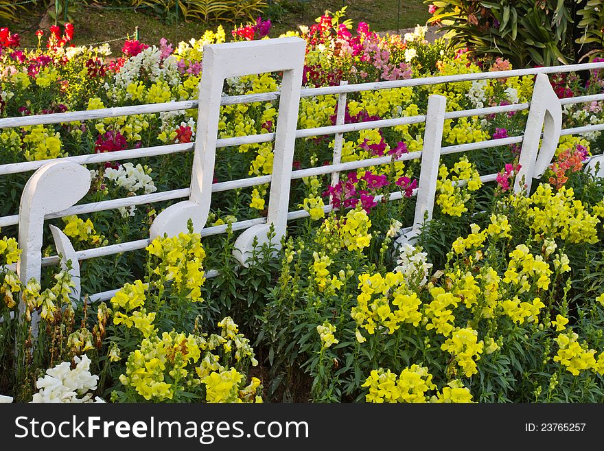 Multicolored flowerbed decorate with musical note