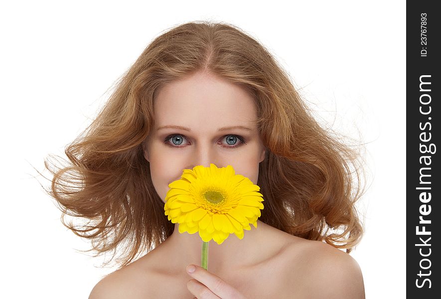 Beautiful girl with flowing hair, yellow gerbera