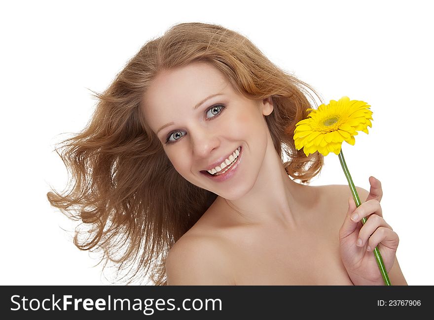 Beautiful young woman with yellow gerbera fl