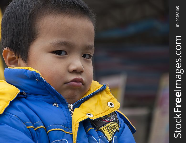 Very angry children. Children in China.The child's cheek.