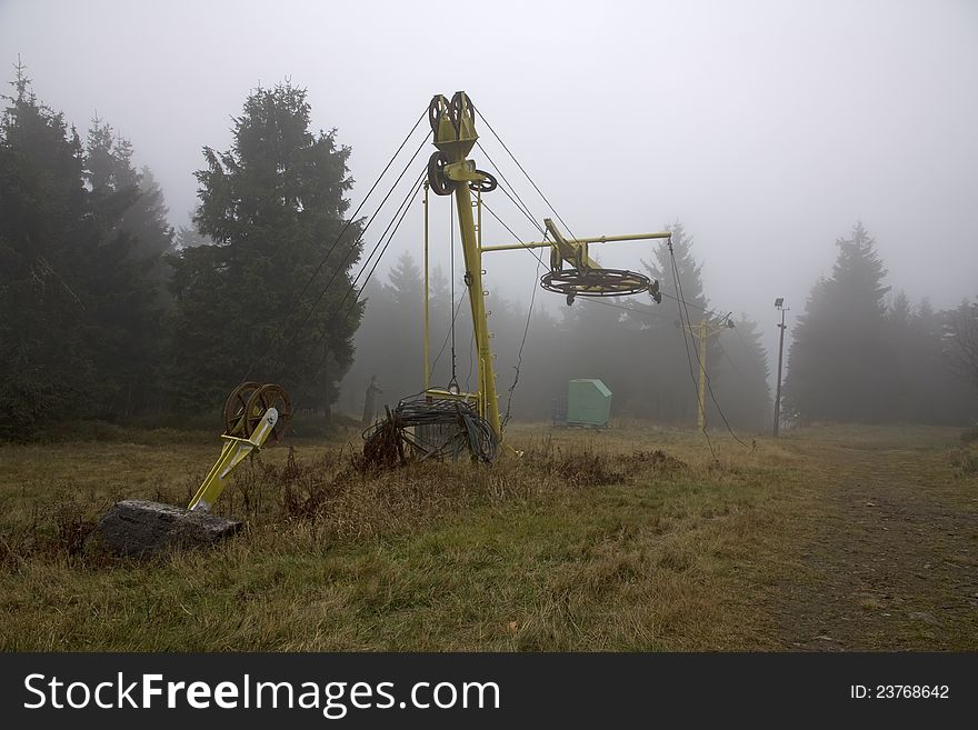 Old car in the Eagle Mountains, yellow cabin in the woods, autumn day in the fog in the mountains, the mountains of the Czech Republic, a place for winter holidays. Old car in the Eagle Mountains, yellow cabin in the woods, autumn day in the fog in the mountains, the mountains of the Czech Republic, a place for winter holidays