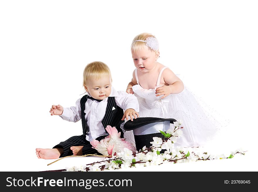 Girl and boy in a dress the bride and groom on a white background